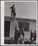 Putting the roof on a prefabricated house at the FSA (Farm Security Administration) project. Pacolet, South Carolina.