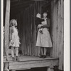 A tenant family in the Camp Croft area watching their belongings being moved out. Near Whitestone, South Carolina.