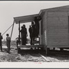 Putting the porch on a prefabricated house built near Pacolet, South Carolina by the FSA (Farm Security Administration) for farmers who had to move out of the Camp Croft area. Pacolet, South Carolina region.