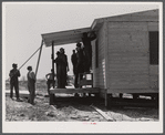 Putting the porch on a prefabricated house built near Pacolet, South Carolina by the FSA (Farm Security Administration) for farmers who had to move out of the Camp Croft area. Pacolet, South Carolina region.