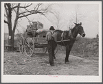 Tenant farmer moving the last load of his belongings out of the Camp Croft area near Pacolet, South Carolina.