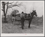 Tenant farmer moving the last load of his belongings out of the Camp Croft area near Pacolet, South Carolina.