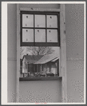 Old tenant house seen thru window of the prefabricated houses on the FSA (Farm Security Administraton) project in the Pacolet, South Carolina region.