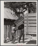 A family moving out of the Spartanburg Army camp area. Near Spartanburg, South Carolina.