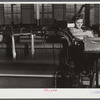 At a loom in the Denomah Mills, Taftville, Connecticut. Makers of cotton and rayon cloths.