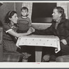 Mr. and Mrs. Clyde Burton and child. Mr. Burton came from Moose Head Lake region, Maine, where he used to run a sportsman's camp. Have been traveling around in a trailer for three years. Had a few weeks work at one of the branches of the iron works a