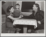 Mr. and Mrs. Clyde Burton and child. Mr. Burton came from Moose Head Lake region, Maine, where he used to run a sportsman's camp. Have been traveling around in a trailer for three years. Had a few weeks work at one of the branches of the iron works a