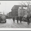 Men coming out of the shipyard at Bath, Maine, during the lunch hour.