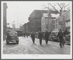 Men coming out of the shipyard at Bath, Maine, during the lunch hour.