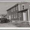 Removing corn cobs at Kenyon's johnnycake flour mill in Usquepaugh, Rhode Island.