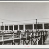 Men leaving the plant of the Browne and Sharpe Manufacturing Company, Providence, Rhode Island, at end of shift.