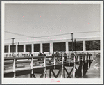 Men leaving the plant of the Browne and Sharpe Manufacturing Company, Providence, Rhode Island, at end of shift.