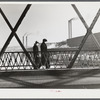 Men going to work in a textile mill in Lawrence, Massachusetts.