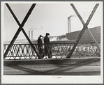 Men going to work in a textile mill in Lawrence, Massachusetts.