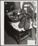Shoes and lunch taken by Mr. Fairchild to work at a steel works in Boston, Massachusetts. He is a vegetable farmer near Saugus, Massachusetts.