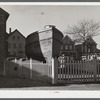 A boat in backyard of house along the waterfront in New Bedford, Massachusetts.