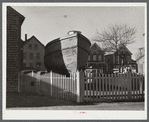 A boat in backyard of house along the waterfront in New Bedford, Massachusetts.
