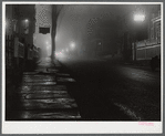 Street in New Bedford at night during a fog. New Bedford, Massachusetts.