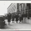 Employees coming out of a textile mill in Lawrence, Massachusetts.