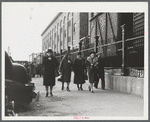 Employees coming out of a textile mill in Lawrence, Massachusetts.