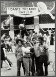 Youth outside entrance to Dance Theatre of Harlem during a street fair