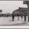 The white schoolhouse in the background was erected by Hazlehurst Farms Inc. to accommodate the increased enrollment as a result of families moving into prefabricated houses.