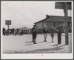 The white schoolhouse in the background was erected by Hazlehurst Farms Inc. to accommodate the increased enrollment as a result of families moving into prefabricated houses.