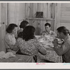 Dinner time at the family of Levy Usher at Hazlehurst Farms. Hazlehurst, Georgia.