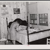 Fixing the curtains to be hung in their new prefabricated house at the home of the Hodge family. Pacolet, South Carolina.
