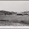 This road is the Camp Croft boundary. The family who lived in the house at the left is moving into the barn on the right.