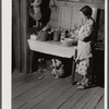 Mrs. L. Smith still has some canned goods left over from the winter. Carroll County, Georgia (see general caption).