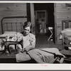 Mrs. L. Smith sews many of the shirts her husband wears when working on the farm. Carroll County, Georgia (see general caption).