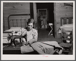 Mrs. L. Smith sews many of the shirts her husband wears when working on the farm. Carroll County, Georgia (see general caption).