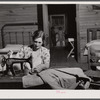 Mrs. L. Smith sews many of the shirts her husband wears when working on the farm. Carroll County, Georgia (see general caption).