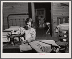 Mrs. L. Smith sews many of the shirts her husband wears when working on the farm. Carroll County, Georgia (see general caption).
