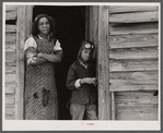 This [Black] woman lives with her husband and two grandchildren in an old converted schoolhouse. All the rest of her children have left the county. Heard County, Georgia.