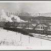 Workers' houses and the Pittsburgh Crucible Steel Corporation in Midland, Pennsylvania.
