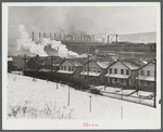 Workers' houses and the Pittsburgh Crucible Steel Corporation in Midland, Pennsylvania.