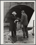 Union member distributing "Steel Labor" near the entrance to the Jones and Laughlin Steel Corporation in Aliquippa Pennsylvania.