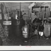 Oil cans and soldering equipment in barn on farm near Rockville, Maryland.