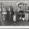 Oil cans and soldering equipment in barn on farm near Rockville, Maryland.