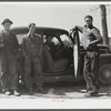 These men stopped at a trailer settlement to see about buying a trailer. They were very uncertain about how long their work would continue at Fort Bragg. Near Fayetteville, North Carolina.