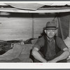 Four men live in this small shack. Two sleep on the lower cot and two on the upper. The whole shack is made so that it can be loaded onto a truck, has no floor all. At present the men work at Fort Bragg, North Carolina. Near Fayetteville, North Carolina.