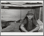 Four men live in this small shack. Two sleep on the lower cot and two on the upper. The whole shack is made so that it can be loaded onto a truck, has no floor all. At present the men work at Fort Bragg, North Carolina. Near Fayetteville, North Carolina.