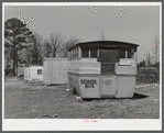 Abandoned school bus occupied by two workers from Fort Bragg, North Carolina in a settlement near the fort.