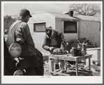 Spraying novelties to be sold along the roadside near Fort Bragg, North Carolina.