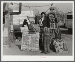 A traveling side-show. "Crime Museum," consisting of a dilapidated effigies of famous criminals run by an old, shellshocked World War veteran. Near Silver Lake, North Carolina.