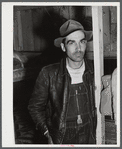Worker employed at Fort Bragg and renting a lower berth in a bunkhouse recently constructed behind a filling station. Near Silver Lake, North Carolina.