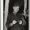 Silver Lake (vicinity), North Carolina. A worker who is employed at Fort Bragg in the doorway of a bunkerhouse in which he rents a lower berth.