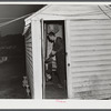 Cooking the evening meal in one of the bunkhouses at a settlement of workers from Fort Bragg. Near Manchester, North Carolina.